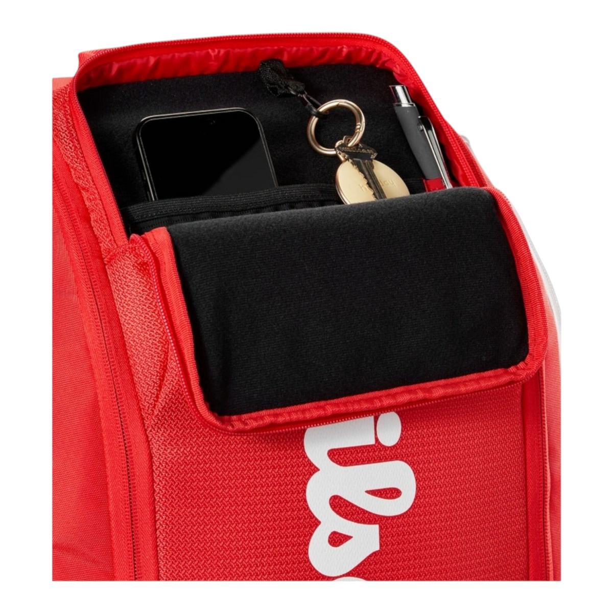 Detalle del compartimento organizador interno de la mochila Radach Sports Wilson Super Tour roja con espacio para accesorios
