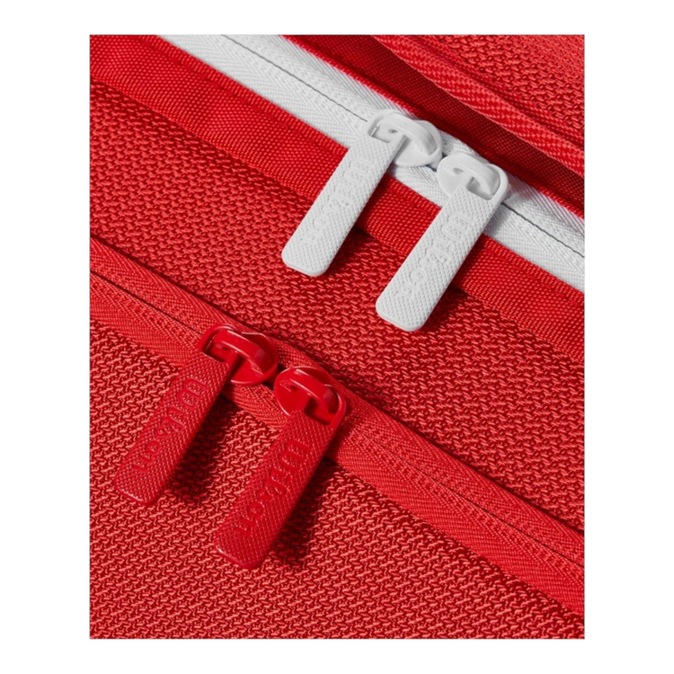 Detalle de cremalleras rojas y blancas en raquetero Radach Sports Wilson Super Tour de poliéster resistente