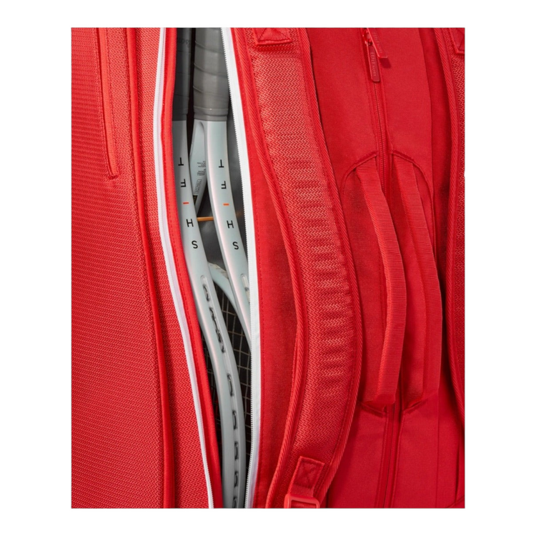 Raquetero Radach Sports Wilson Super Tour rojo con compartimento abierto mostrando raquetas de tenis en su interior