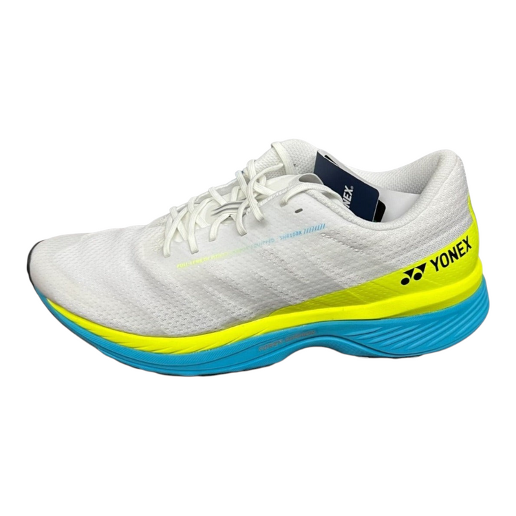 Tenis de correr Radach Sports Yonex Saferun 100X para mujer en color blanco con detalles en amarillo y azul