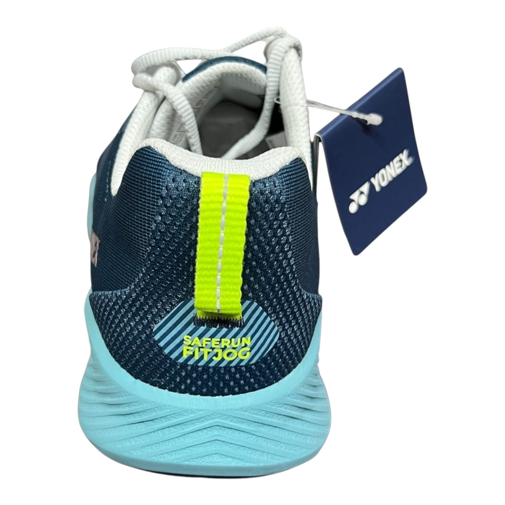 Vista trasera de tenis Radach Sports Yonex Saferun Fitjog en color azul profundo con detalle de tirador amarillo neón